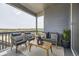 Covered patio with comfortable seating and scenic views at 13812 Honey Hush Trl, Parker, CO 80134