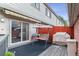 Cozy back porch with a swing and outdoor seating area for relaxing at 4231 S Fairplay Cir # E, Aurora, CO 80014