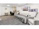 Finished basement with daybed, chair, and recreational decor at 4231 S Fairplay Cir # E, Aurora, CO 80014