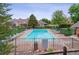 Inviting community pool surrounded by lush landscaping and comfortable lounge chairs, ideal for relaxation at 4231 S Fairplay Cir # E, Aurora, CO 80014