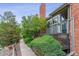 Charming townhome exterior with a well-maintained walkway and inviting entryway, offering a welcoming ambiance at 4231 S Fairplay Cir # E, Aurora, CO 80014