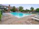 Inviting community swimming pool with lounge chairs, perfect for relaxation and enjoying sunny days at 4231 S Fairplay Cir # E, Aurora, CO 80014