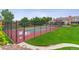 Community tennis court surrounded by lush landscaping, offering a perfect outdoor recreational space at 4231 S Fairplay Cir # E, Aurora, CO 80014
