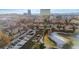 Aerial view of townhouses with snow-covered parking lot and surrounding landscape at 4862 E Kentucky Ave # D, Denver, CO 80246