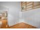 Simple bedroom with hardwood floors and built-in shelves at 4862 E Kentucky Ave # D, Denver, CO 80246