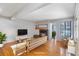 Virtually staged living room featuring a fireplace and hardwood floors at 4862 E Kentucky Ave # D, Denver, CO 80246