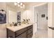 Bathroom with a single vanity and view into hallway at 5232 Truckee St, Denver, CO 80249