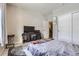 Bedroom with a TV, carpet, and sliding door closet at 5232 Truckee St, Denver, CO 80249