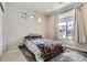 Bright bedroom with a platform bed and large window at 5232 Truckee St, Denver, CO 80249