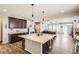 Spacious kitchen with island, stainless steel appliances, and dark wood cabinets at 5232 Truckee St, Denver, CO 80249