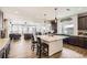 Kitchen with island, dark cabinets, and granite countertops at 5232 Truckee St, Denver, CO 80249