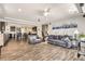 Open concept living room with kitchen view and tile floors at 5232 Truckee St, Denver, CO 80249