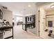 Upstairs office with built-in shelving and a view of a bathroom at 5232 Truckee St, Denver, CO 80249