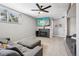 Finished basement with modern fireplace, mounted TV, and carpeted floors at 3491 Kassler Pl, Westminster, CO 80031