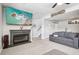 Finished basement with modern fireplace, mounted TV, and carpeted floors at 3491 Kassler Pl, Westminster, CO 80031