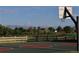 Outdoor basketball court in a community park with mountain views and a fenced perimeter at 3491 Kassler Pl, Westminster, CO 80031