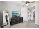Bedroom with gray walls, dresser with television, closet, and ceiling fan at 3491 Kassler Pl, Westminster, CO 80031