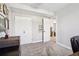 Bedroom with large closet, gray walls, white trim, and a dresser at 3491 Kassler Pl, Westminster, CO 80031