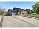 View of the home showing the driveway, garage and newly landscaped yard at 3491 Kassler Pl, Westminster, CO 80031