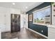 Modern kitchen with stainless steel refrigerator, slate floors, and bright natural light at 3491 Kassler Pl, Westminster, CO 80031