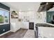 Modern kitchen with white cabinetry, stainless steel appliances, and a bright window view at 3491 Kassler Pl, Westminster, CO 80031