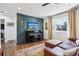 Comfortable living room featuring a decorative wall with a piano and TV at 3491 Kassler Pl, Westminster, CO 80031