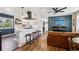 Stylish living space features an open concept to the kitchen and a decorative accent wall at 3491 Kassler Pl, Westminster, CO 80031