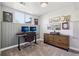 Office with dual monitors, gray walls, and a wooden dresser at 3491 Kassler Pl, Westminster, CO 80031