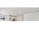 Bright kitchen featuring stainless steel appliances, white cabinets and an island with quartz countertops at 8295 Snake River St, Littleton, CO 80125