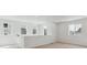 Upstairs loft offering multiple windows and neutral carpeting, providing a relaxing space at 8295 Snake River St, Littleton, CO 80125