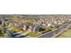 Scenic aerial view of a neighborhood with well-maintained lawns and mature trees at 21851 Omaha Ave, Parker, CO 80138