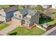 Lovely home with a cozy front porch, a well-kept yard, and an attached two-car garage at 21851 Omaha Ave, Parker, CO 80138