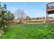Large, well-maintained backyard with green grass and a wooden fence at 21851 Omaha Ave, Parker, CO 80138