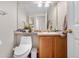 Bathroom with a vanity, sink, mirror, and a toilet with a bidet feature at 21851 Omaha Ave, Parker, CO 80138