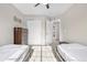 Bedroom with carpet flooring, a ceiling fan, closet, and two twin beds at 21851 Omaha Ave, Parker, CO 80138