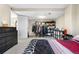 Large bedroom with open closet space, dressers and a comfortable bed at 21851 Omaha Ave, Parker, CO 80138