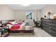 Bedroom with a bed, a dresser, and a window providing natural light at 21851 Omaha Ave, Parker, CO 80138