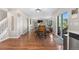 Open floorplan with dining area showcasing hardwood floors, and sliding door to the backyard at 21851 Omaha Ave, Parker, CO 80138