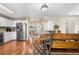 Dining area with stainless steel appliances, modern lighting, and access to the outside view at 21851 Omaha Ave, Parker, CO 80138