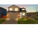 Charming two-story home featuring a brick-accented garage and inviting front porch at 21851 Omaha Ave, Parker, CO 80138