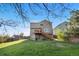 View of the back of the home, showcasing the deck and large backyard at 21851 Omaha Ave, Parker, CO 80138