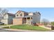 Charming home with a well-manicured lawn and inviting front porch at 21851 Omaha Ave, Parker, CO 80138