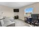 Bright office space with a large window, comfortable seating, and a dedicated workspace at 21851 Omaha Ave, Parker, CO 80138