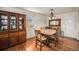 Hardwood floors grace the dining area with a vintage hutch at 6305 Yukon St, Arvada, CO 80004