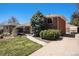 Single-Gathering home with a well-maintained lawn and a paved driveway at 6305 Yukon St, Arvada, CO 80004