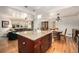 A gourmet kitchen flows into the living and dining areas at 6305 Yukon St, Arvada, CO 80004