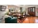 Inviting living room with hardwood floors and a large window at 6305 Yukon St, Arvada, CO 80004