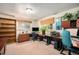 Bright home office with built in desk, wall decor, and a built in bookshelf at 6305 Yukon St, Arvada, CO 80004