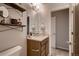 Cozy bathroom featuring modern vanity with fixtures at 6309 N Hanover St, Denver, CO 80238