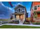 Charming blue two-story home with a red front door and covered porch, creating a welcoming curb appeal at 6309 N Hanover St, Denver, CO 80238